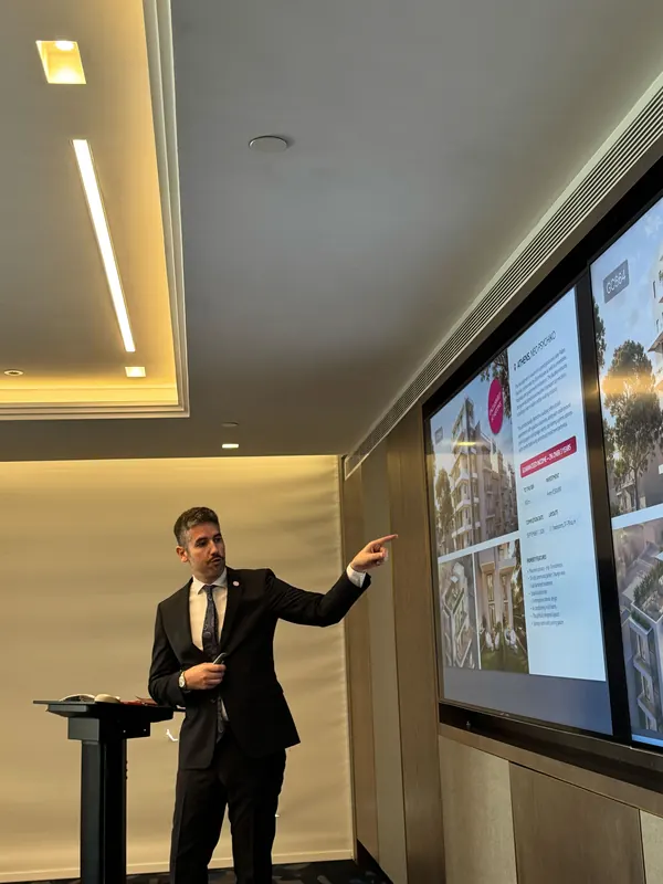 An Astons advisor presenting real estate projects
