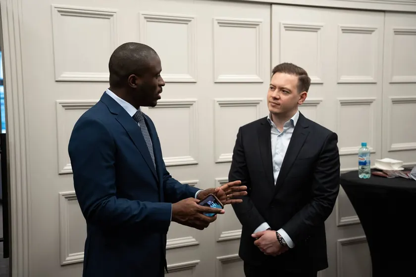 An Astons advisor talking with a client