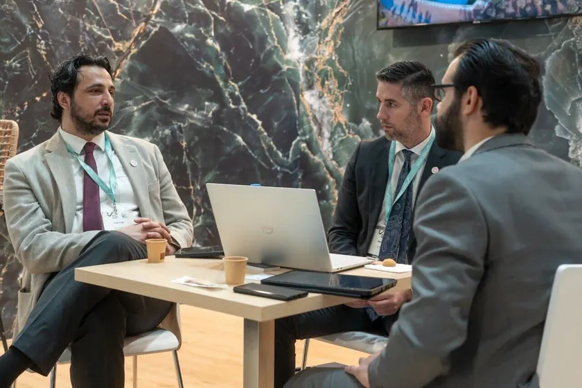 Astons advisors meeting clients at an event in Greece